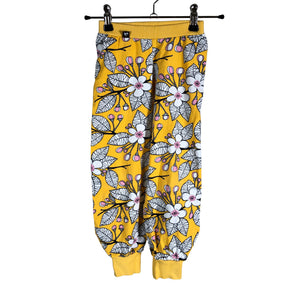 Unisex Maitotyttö - Trikoohousut, koko 98 - 104 -  (1)